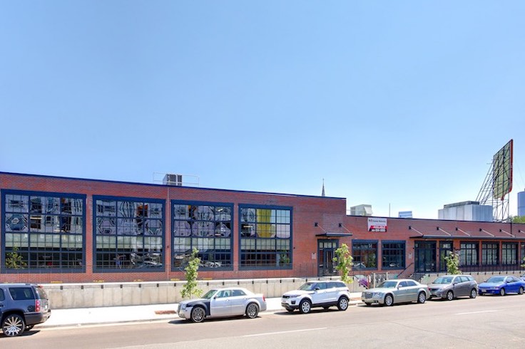 The building's brick facade is accented by steel-framed windows