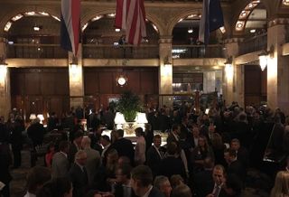 People attending the Historic Denver gala enjoy cocktails at the historic Brown Palace Hotel.