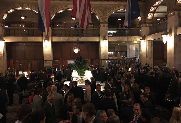 People attending the Historic Denver gala enjoy cocktails at the historic Brown Palace Hotel.