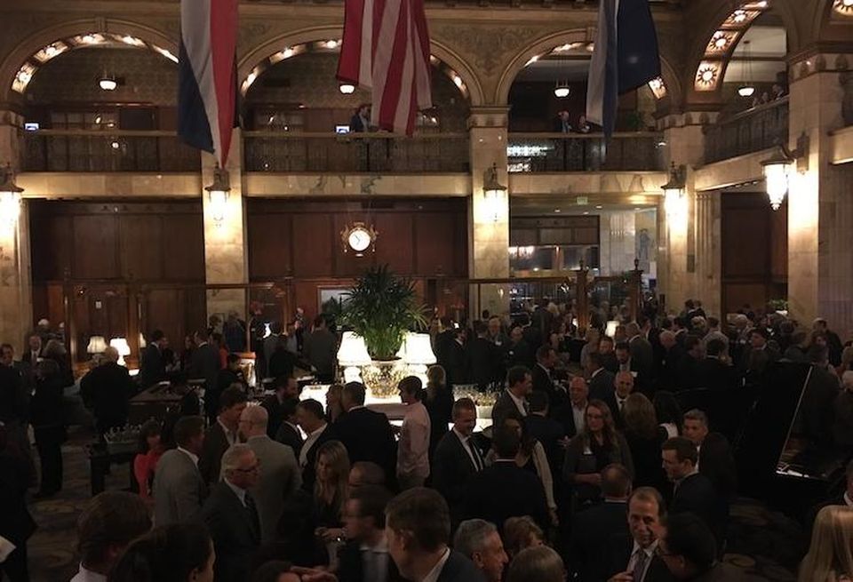 People attending the Historic Denver gala enjoy cocktails at the historic Brown Palace Hotel.