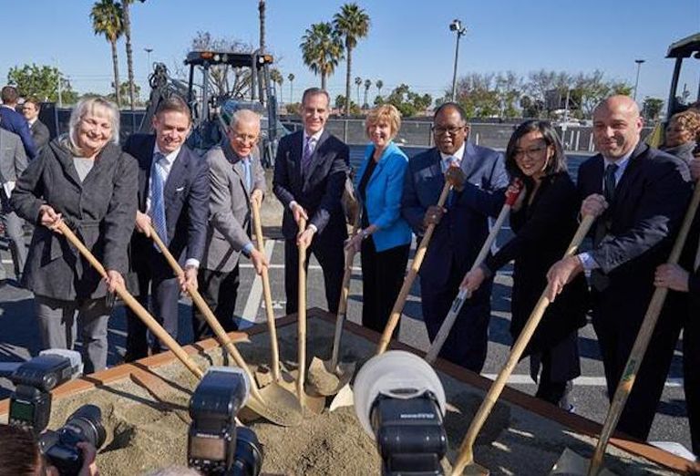 Los Angeles Mayor Eric Garcetti (center), along with other city officials break ground on LAX's Automated People Mover