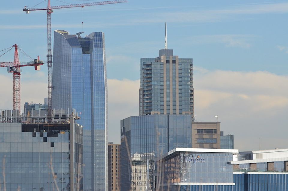 Unicom Capital leased the top floor of 1144 Fifteenth, the tallest of the buildings pictured