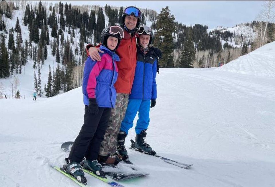 Aligned CEO Andrew Schaap skiing with his kids.