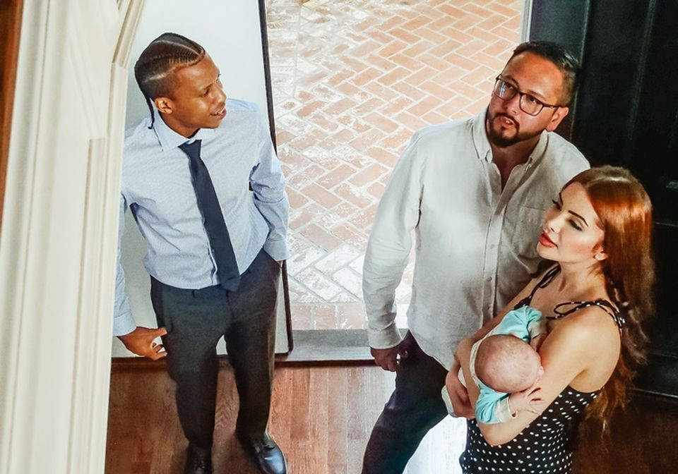 Real estate agent showing an apartment to prospective renters. 