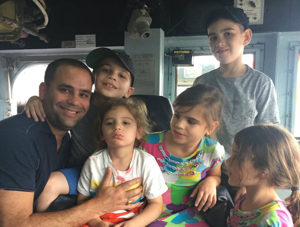 Stellar Management Principal and COO, and former Naval officer, Adam Roman and family