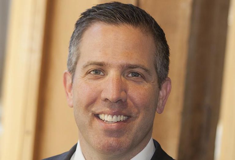 A traditional headshot of Mortenson Rocky Mountain Region Vice President Taber Sweet.