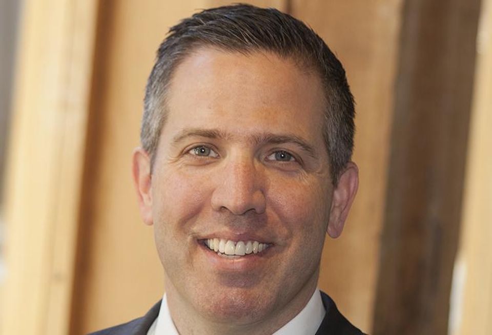 A traditional headshot of Mortenson Rocky Mountain Region Vice President Taber Sweet.