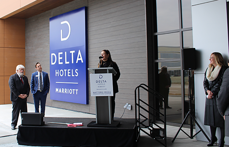 Stacy Martin, Managing Director of the Delta Hotel by Marriott Dallas Allen & Watters Creek Convention Center speaks at the ribbon cutting of the first Delta Hotels hotel in the Dallas area.