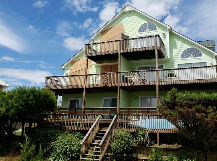 Half of a duplex is boarded up at Emerald Isle, N.C., in anticipation of Hurricane Florence on Sept. 11, 2018. Half of a duplex is boarded up at Emerald Isle, N.C., in anticipation of Hurricane Florence on September 11, 2018.