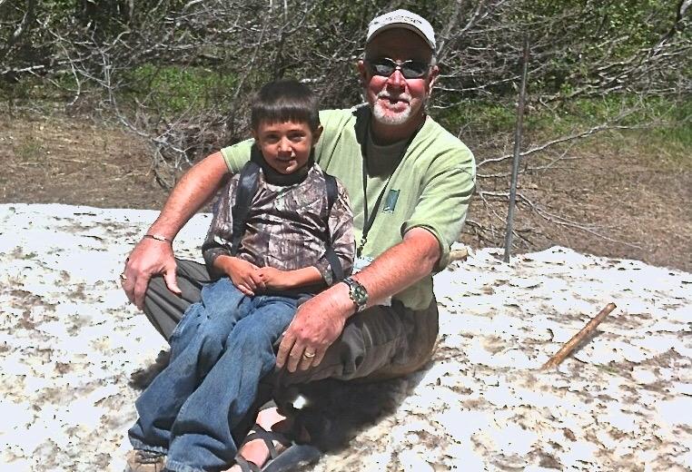 Brad McJunkin, Director of Acquisitions and Development at TIG, with grandson Isaiah hiking in Estes Park