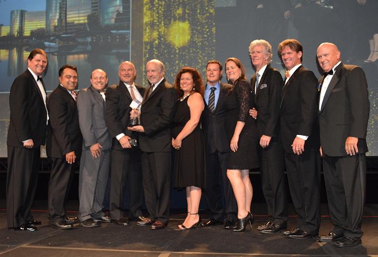 Oracle Redwood Shores takes corporate TOBY; Capstone Property Management president Kent Gibson, BOMA International chair and BOMA Fellow (far left); The Home Depot national PRO manager Earl Madison (second from right); and Parmenter Realty Partners managing director of facilities and sustainability Steve Harrison, a BOMA Fellow and TOBY Award chair (far right) presented the award.