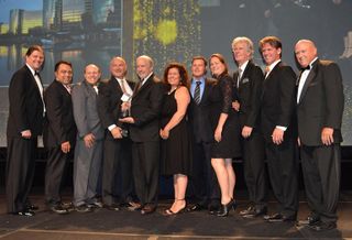 Oracle Redwood Shores takes corporate TOBY; Capstone Property Management president Kent Gibson, BOMA International chair and BOMA Fellow (far left); The Home Depot national PRO manager Earl Madison (second from right); and Parmenter Realty Partners managing director of facilities and sustainability Steve Harrison, a BOMA Fellow and TOBY Award chair (far right) presented the award.