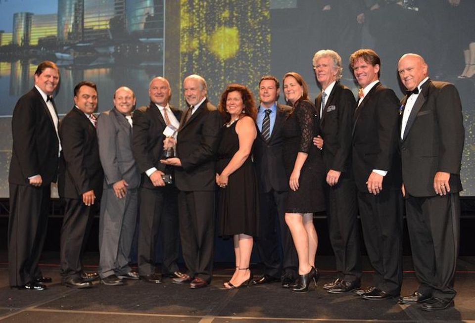 Oracle Redwood Shores takes corporate TOBY; Capstone Property Management president Kent Gibson, BOMA International chair and BOMA Fellow (far left); The Home Depot national PRO manager Earl Madison (second from right); and Parmenter Realty Partners managing director of facilities and sustainability Steve Harrison, a BOMA Fellow and TOBY Award chair (far right) presented the award.