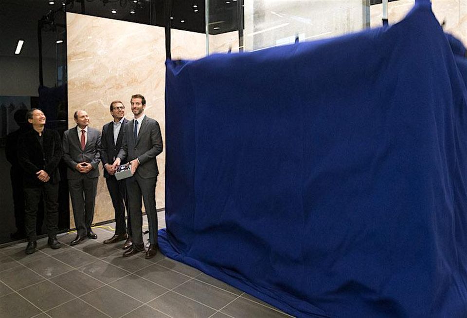 Watching the curtain drop on the Banksy installation (left to right) designer Johnson Chou, Menkes high rise residential president Alan Menkes; Menkes commercial development president Peter Menkes; and vice-president high-rise residential Jared Menkes.