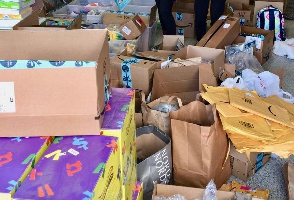 Piles of donated goods inside Jenifer Levy's home in Orange County.