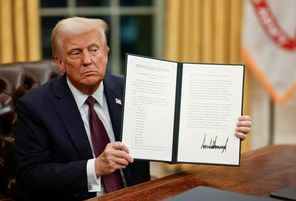 President Donald Trump signed executive orders in the Oval Office Monday evening.