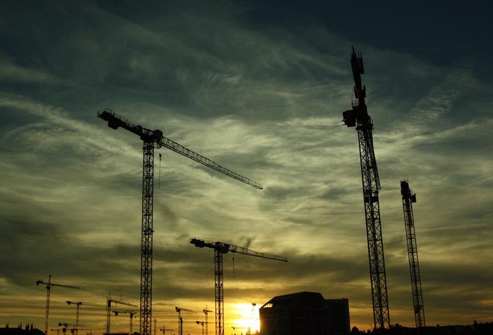 Construction cranes at night