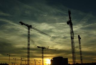 Construction cranes at night