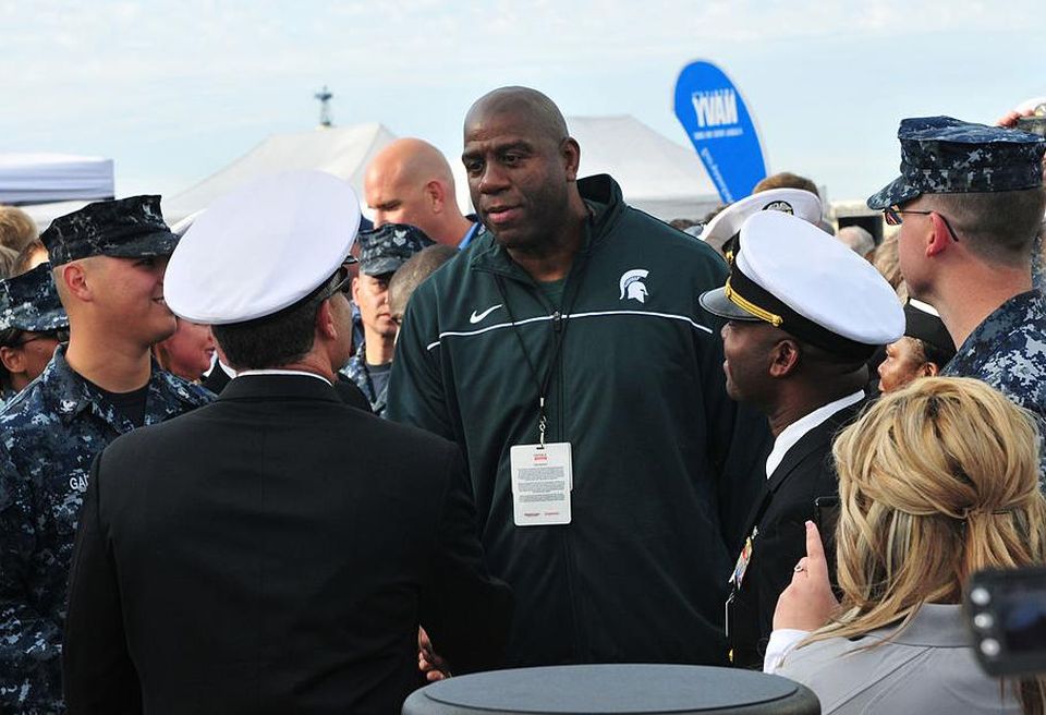 SAN DIEGO (Nov. 11, 2011) Magic Johnson greets service members attending the Quicken Loans Carrier Classic basketball game on the flight deck of the aircraft carrier USS Carl Vinson (CVN 70). Carl Vinson is hosting Michigan State University and the University of North Carolina for an NCAA basketball game. (U.S. Navy photo by Mass Communication Specialist Seaman Apprentice George Bell/Released)