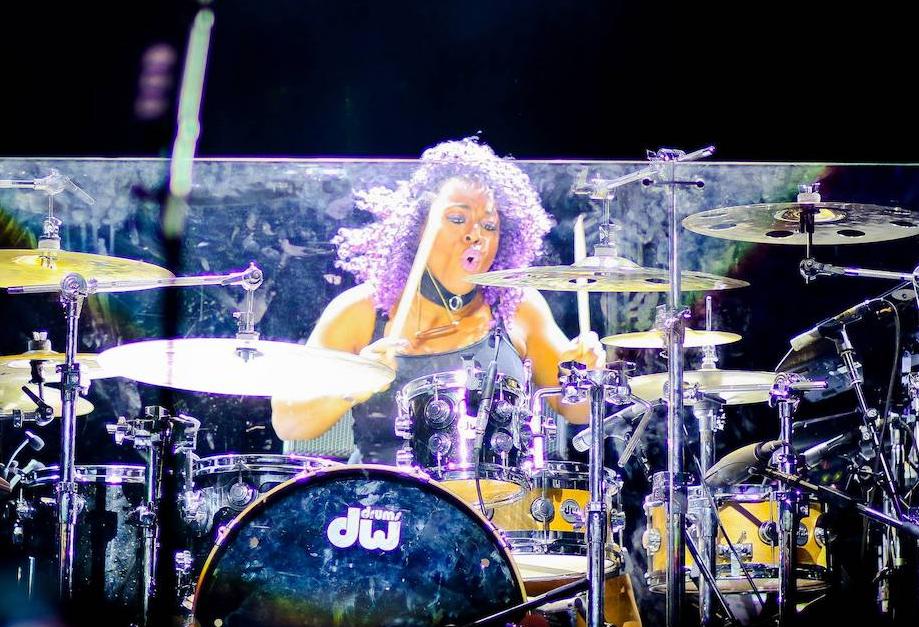 From Drumming With Prince And Beyoncé To Building With Shipping Containers: Queen Cora Constructs Hurricane-Resistant Projects