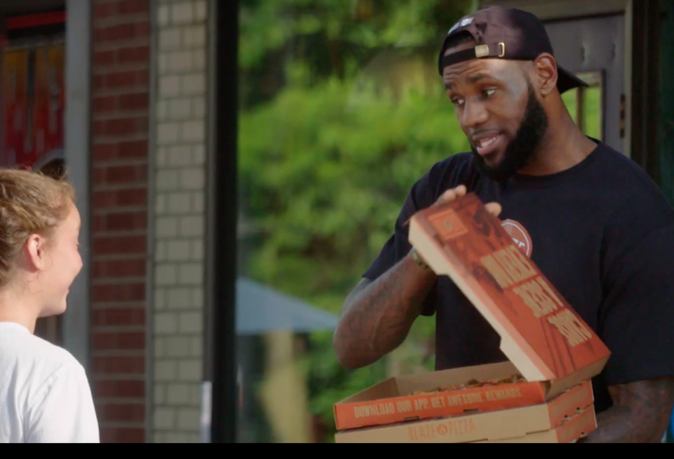 LeBron James delivers pizza in Akron, Ohio, in a commercial for Blaze Pizza, the chain he co-owns.