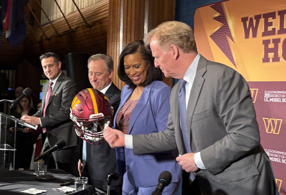 Sports broadcaster Bram Weinstein, Commanders owners Josh Harris, D.C. Mayor Muriel Bowser and NFL Commissioner Roger Goodell at Monday's announcement of the RFK Stadium deal.