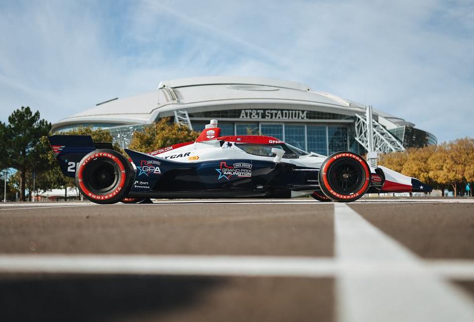 Indycar vehicle in front of AT&T Stadium. 