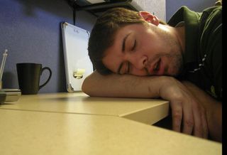 bored sleeping nap office