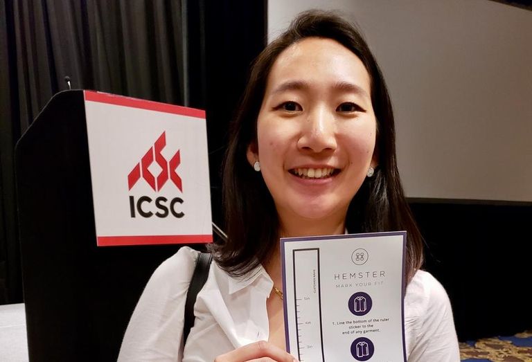 Hemster CEO Allison Lee holds up her patent pending ruler sticker that easily allows sales associates to measure a customer at the ICSC RECon event in Las Vegas.