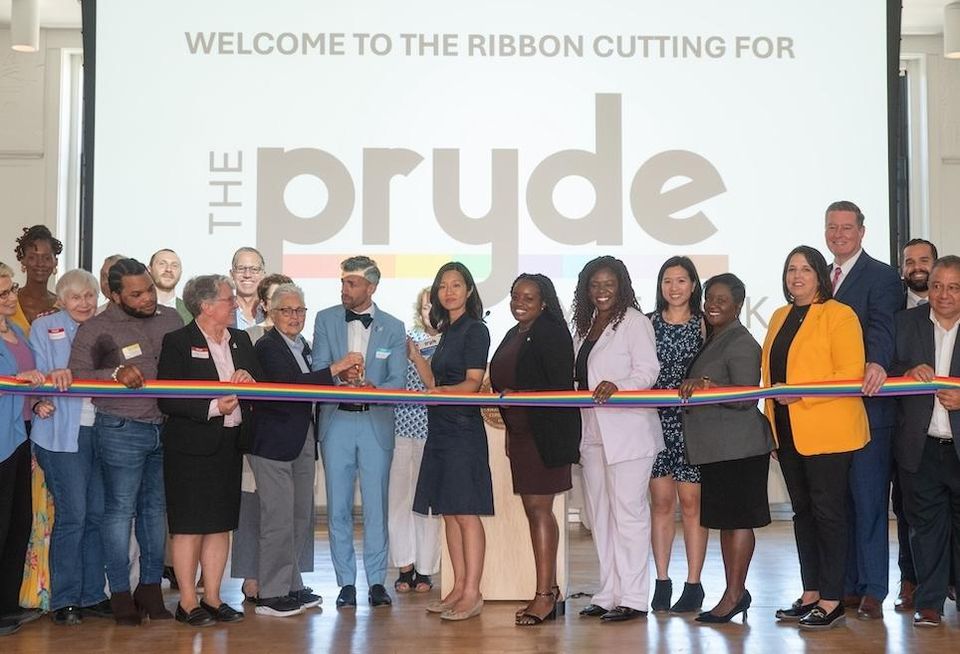 Boston officials including Mayor Michelle Wu with the development team at the opening of the Pryde, an LGBTQ-affirming senior housing building. 