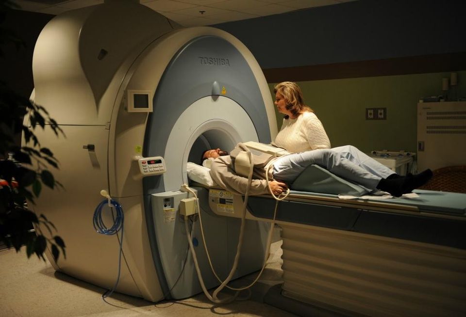 Susan Priebe, 375th Medical Support Squadron Diagnostic Imaging Flight MRI technologist, prepares a patient for an MRI Jan. 4, 2011, at the Scott Family Clinic. The flight offers Magnetic Resonance Imaging (MRI), Nuclear Medicine, Computerized Axial Tomography (CAT or CT scan), ultrasounds and X-rays.