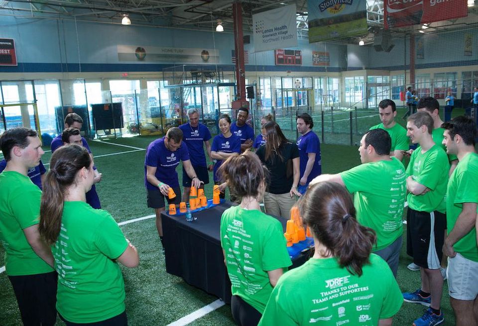 Cup stacking competition at the second annual JDRF Real Estate Games at Chelsea Piers.