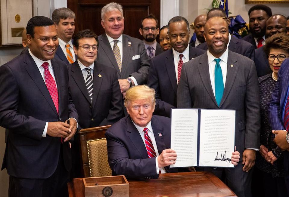 President Donald Trump displays his signature Dec. 12, 2018, after signing the Executive Order to establish the White House Opportunity and Revitalization Council in the Roosevelt Room of the White House.