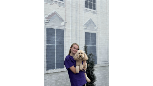 The Pet Palace Groomer Jasmine with dog.