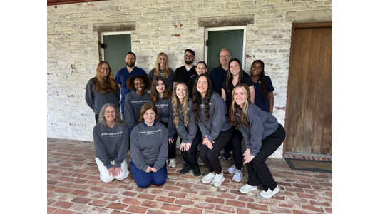 Animal Health Clinic Staff posing in front of the Baton Rouge, LA Clnic