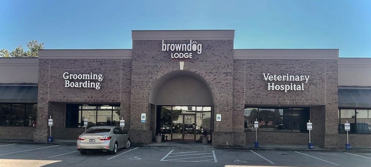 Brown dog lodge vet exterior building front