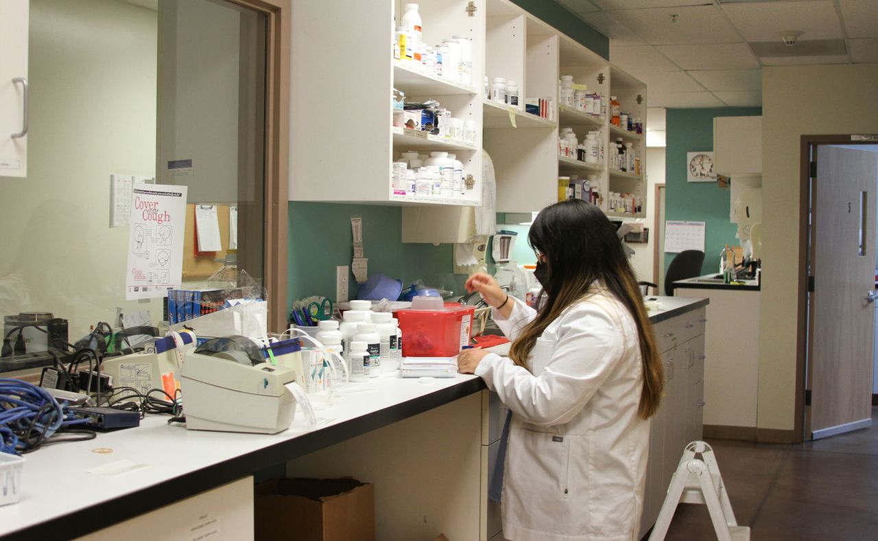 Female clinic staff running diagnostics